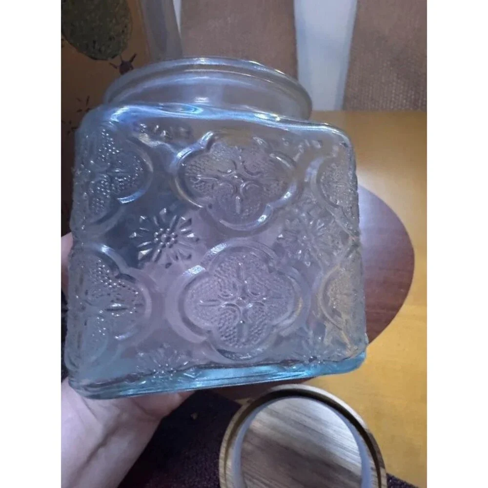 Embossed glass storage jar